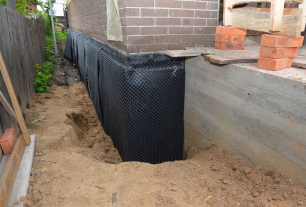 Happy homeowners after waterproofing job in Irving